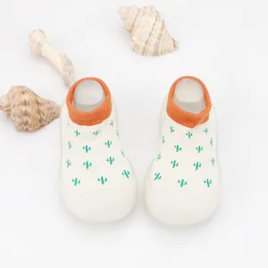 Breathable baby sock shoes featuring cute green cactus print and vibrant orange rib cuffs