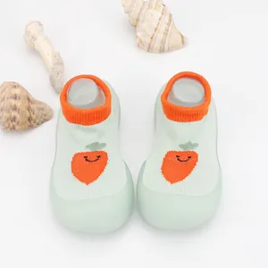 Close-up of breathable knit baby walking shoes with a cute carrot pattern detail