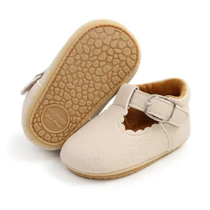 Detailed view of beige baby princess shoes featuring a pebble-textured rubber sole