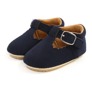 Detailed view of navy blue suede baby Mary Jane shoes featuring scalloped edges