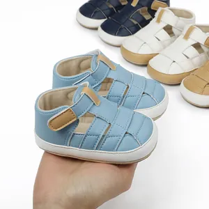 Close-up of blue breathable baby sandals with soft soles and velcro straps