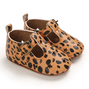Macro view of leopard print PU leather baby pre-walker shoes featuring star cutouts