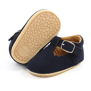 Detail view of navy blue baby girl Mary Jane shoes with anti-slip rubber sole