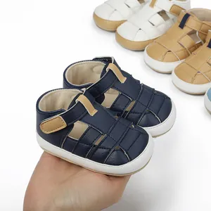 Detailed view of breathable navy blue baby sandals with soft soles for walking