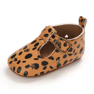 Detailed view of leopard print baby pre-walker shoe featuring star-shaped cutouts and a buckle
