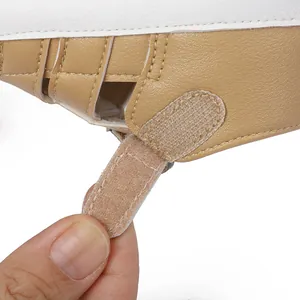 Macro detail view showing the secure hook-and-loop closure on a tan baby sandal.