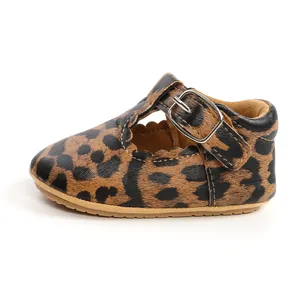 Detail of leopard print baby girl walker shoes with rubber sole and buckle