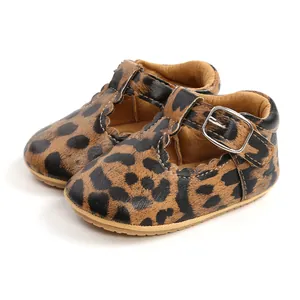 Detailed view of leopard print baby Mary Jane shoes with scalloped edges and buckle