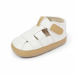 Side view of white and tan baby walker sandals featuring a breathable closed-toe design