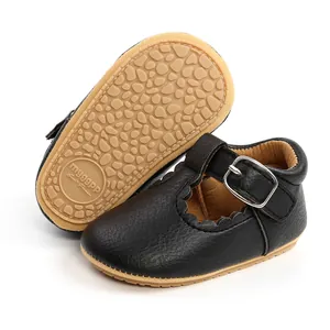 Detail of black toddler princess shoes showing scalloped edges and non-slip rubber sole.