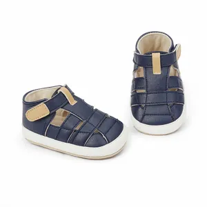 Breathable navy baby sandals with beige hook-and-loop straps and soft white soles