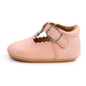 Side view of pink baby girl princess shoes with scalloped edges and buckle strap