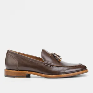 Detailed side view of premium dark brown leather tassel loafers for men