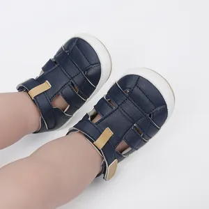 Close-up of navy blue baby sandals worn on feet for summer breathable comfort