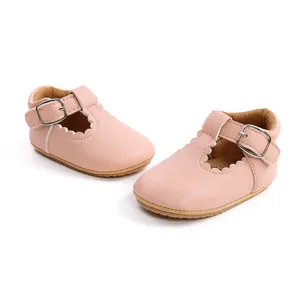 Detailed view of pink toddler girl Mary Jane shoes with scalloped edges