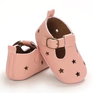Detail view of soft pink PU leather baby pre-walker shoes with star cutouts and buckle