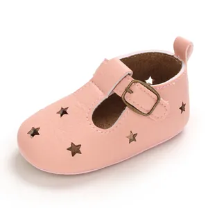 Detailed view of pink soft PU leather baby shoes with decorative star-shaped cutouts
