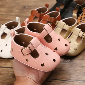 Detailed view of breathable star-cutout baby walking sandals in pink, gold and white