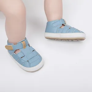 Detailed view of breathable light blue baby summer sandals with hook and loop straps