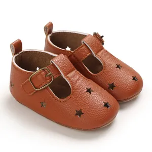 Brown PU leather baby pre-walker shoes with star cutouts and buckle strap detail