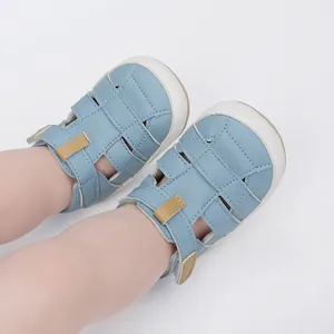 Light blue breathable soft-sole baby sandals with strappy design on baby's feet