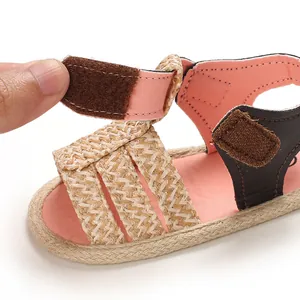 Close-up of hook-and-loop fastener on pink baby girl summer walking shoes