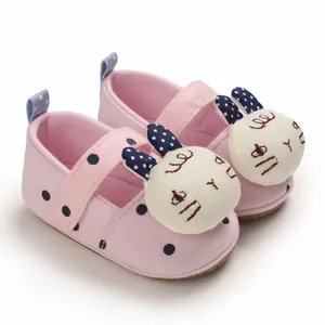 Soft sole pink baby walking shoes with blue polka dots and cute 3D stuffed bunny decor