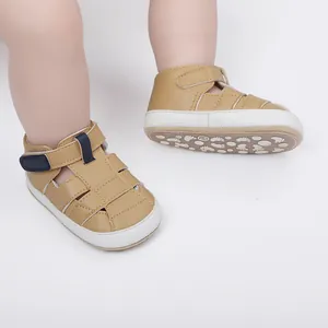 Detail view of khaki baby summer sandals with non-slip soles and velcro strap