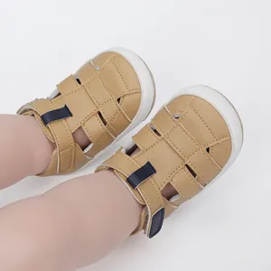 Close-up detail of breathable tan faux leather baby sandals worn by an infant.