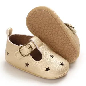 Golden PU leather baby pre-walker shoes featuring star cutouts and adjustable buckle strap
