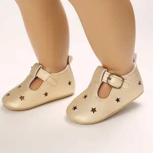 Detailed view of golden PU leather baby pre-walker shoes featuring star-shaped cutouts.