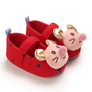 Detailed view of red soft-sole baby walker shoes with cute pink cartoon character