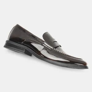 Side view detail of men's dark brown patent leather penny loafer with glossy finish