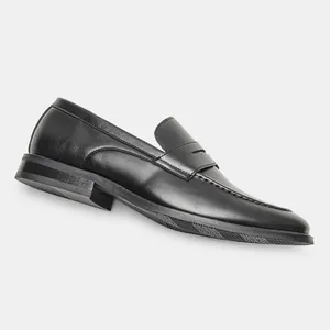 Side view detail showing the sleek finish of classic black men's loafers for formal wear