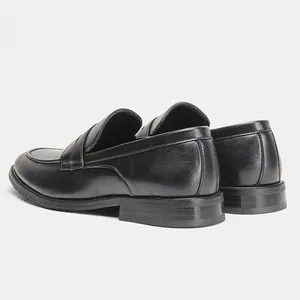 Rear view of classic black men's leather loafers showing heel and stitching details