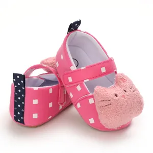 Detail view of pink baby pre-walker shoes featuring a soft plush cartoon cat face
