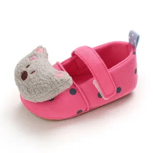 Soft-sole baby girl walking shoes in pink with polka dots and cartoon bear head detail