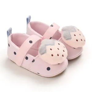 Cute pink baby girl soft sole walker shoes with polka dots and plush strawberry detail