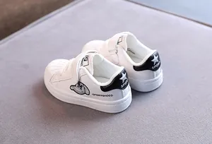 White shell-toe sneakers for toddlers with soft soles and velcro straps for daily casual wear