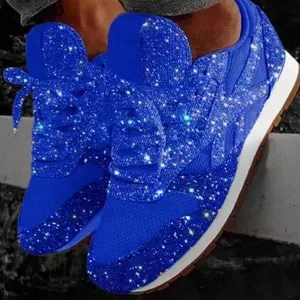 Detailed macro view of shimmering electric blue sequin surface on women's leisure sneakers.