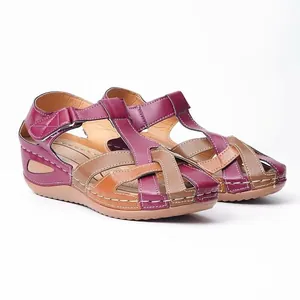 Retro wedge sandals featuring multicolored T-strap design and white contrast stitching.