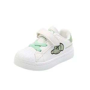 Classic white shell-toe sneakers for toddlers with mint green accents and soft soles