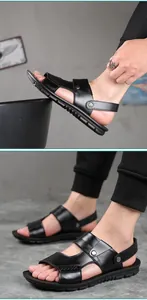 Detail view of men's black leather beach sandals with adjustable straps and studs.