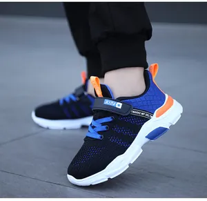 Side view of boys breathable mesh running sneakers featuring blue and orange accents