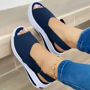Detail view of navy blue peep toe platform sandals with adjustable Velcro strap.