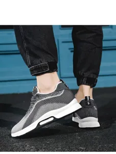 Close-up of men's flying woven sneakers with breathable mesh and 6cm height boost.