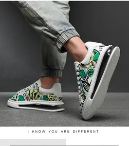 Detailed side view of stylish men's graffiti print sneakers with a thick air cushion sole