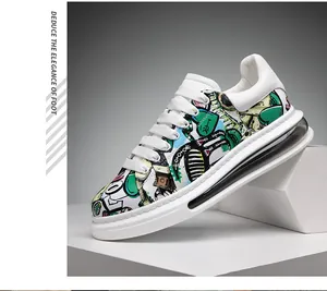 Fashionable graffiti print sneaker featuring a thick white sole and clear heel detail.