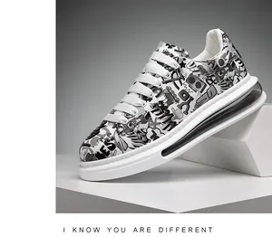 Close-up of men's casual sneakers with black and white graffiti print and air cushion