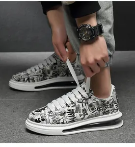 Close-up action shot of men's graffiti print streetwear sneakers with thick soles